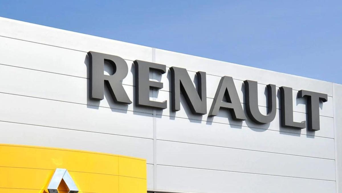 Renault dealership exterior showing large Renault logo on building facade