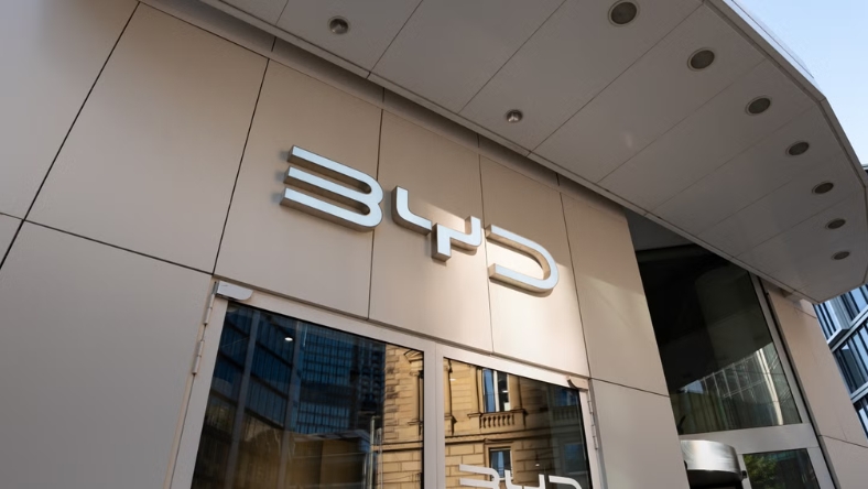 BYD logo on the exterior of a modern office building in Europe