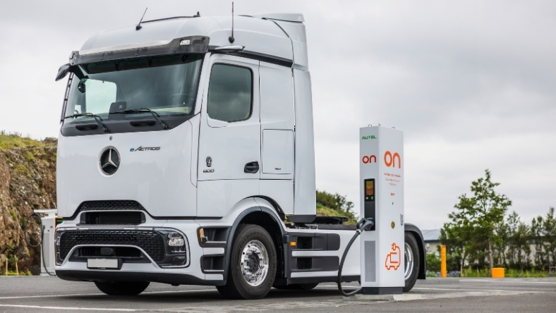 Electric semi-truck connected to high-power charging station